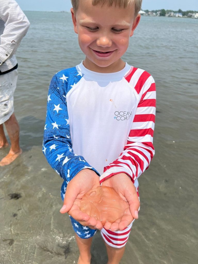 Boy holds jellyfish
