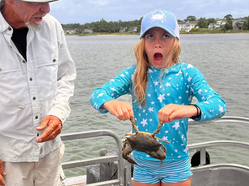 Hamming it up with a live crab - part of the captain barry experience